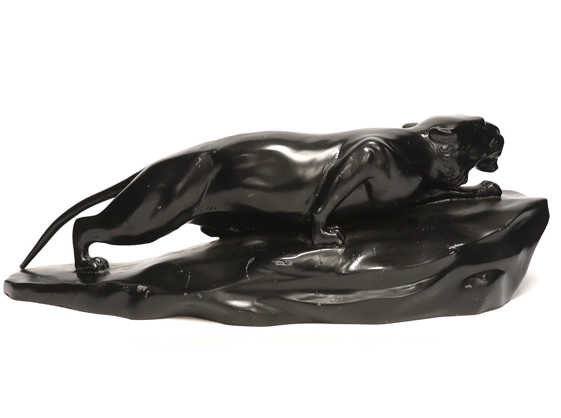 A bronzed black painted spelter panther, 50cm wide